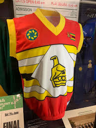 Zimbabwe's 1999 jersey, red and yellow with national emblem